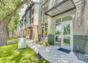 Thumbnail 45 of 53 - Leasing center entrance with glass doors at The Barton Apartments, Dallas, Texas