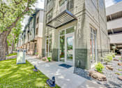Thumbnail 46 of 53 - Modern building exterior with glass entry doors at The Barton Apartments, Dallas