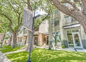 Thumbnail 50 of 53 - Modern building exterior with landscaped lawn at The Barton Apartments, Texas