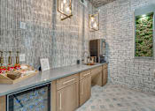 Thumbnail 22 of 53 - Coffee bar with beverage station and refrigerator at The Barton Apartments, Dallas
