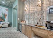 Thumbnail 23 of 53 - Wet bar area with gold sink and modern fixtures at The Barton Apartments, Texas