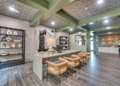 Thumbnail 23 of 69 - A modern kitchen with a bar area and seating.