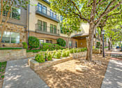 Thumbnail 65 of 69 - A tree in front of a house.