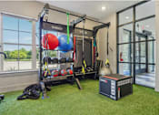Thumbnail 29 of 53 - home gym with a squat rack at Vine + Vail Townhomes and Apartments, Texas, 76051