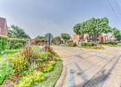Thumbnail 35 of 42 - A street view with a stop sign and a building in the background at Copper Hill Apartments, Bedford, TX