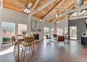 Thumbnail 24 of 42 - A spacious living room with wooden floors and a high ceiling at Copper Hill Apartments, Bedford 76021