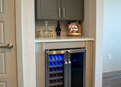 Thumbnail 4 of 39 - A wine cooler is built into a kitchen island.