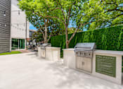 Thumbnail 36 of 53 - Outdoor grilling stations with built in amenities at The Barton Apartments, Dallas, 75206