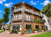 Thumbnail 50 of 52 - Leasing center entrance with checkered facade at The Montrose Apartments, Dallas, TX