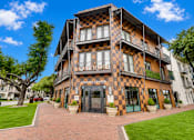 Thumbnail 51 of 52 - Leasing center entrance with checkerboard facade at The Montrose Apartments, Dallas, Texas