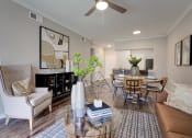 Thumbnail 1 of 39 - Living Room With Kitchen View at Highland Luxury Living, Lewisville, 75067