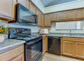 Thumbnail 4 of 32 - A kitchen at Hunters Hill, Dallas, TX
