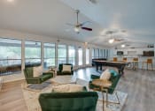 Thumbnail 18 of 57 - a living room with furniture and a pool table at Indian Creek Apartments, Texas