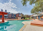 Thumbnail 33 of 57 - our apartments at the district feature a swimming pool at Indian Creek Apartments, Carrollton, TX, 75007