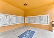 Thumbnail 59 of 68 - A room with a calendar on the wall and a mat on the floor with the word LUMA on it at Limestone Ranch Apartments, Lewisville, TX