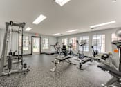 Thumbnail 28 of 51 - A spacious gym with various exercise equipment. at The Manhattan Apartments, Dallas, TX