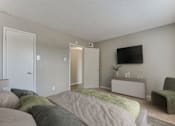 Thumbnail 15 of 51 - Bedroom With TV at The Manhattan Apartments, Dallas, Texas