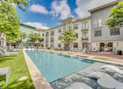 Thumbnail 35 of 52 - Courtyard pool with spa and seating areas at The Montrose Apartments, Texas, 75204