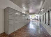 Thumbnail 49 of 52 - Package locker room with parcel lockers and mailboxes at The Montrose Apartments, Dallas, TX 75204