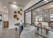 Thumbnail 23 of 52 - Modern leasing office with decorative wall art at The Montrose Apartments, Dallas, 75204
