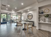 Thumbnail 16 of 52 - Resident dining area with built in shelving at The Montrose Apartments, Dallas, TX 75204