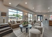 Thumbnail 14 of 52 - Clubhouse lobby with contemporary furnishings and reception desk at The Montrose Apartments, Dallas