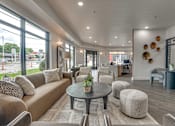 Thumbnail 15 of 52 - Bright lobby with seating and reception area at The Montrose Apartments, Texas