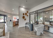 Thumbnail 21 of 52 - Leasing office lobby with reception desk and seating at The Montrose Apartments, Texas, 75204