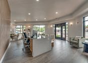 Thumbnail 19 of 52 - Leasing office with reception desk and seating area at The Montrose Apartments, Dallas, 75204