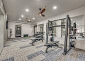 Thumbnail 44 of 52 - Fitness center with weight training equipment at The Montrose Apartments, Texas