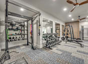 Thumbnail 42 of 52 - Fully equipped fitness center with free weights at The Montrose Apartments, Texas, 75204