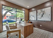 Thumbnail 28 of 52 - Private office with street view and abstract art at The Montrose Apartments, Dallas