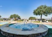 Thumbnail 23 of 41 - a fountain in a park with a pool and trees at Paces Crossing, Denton