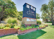 Thumbnail 41 of 41 - a garden with a clock tower on top of a brick wall at Paces Crossing, Denton, TX