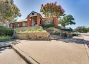 Thumbnail 40 of 41 - a brick retaining wall in front of a house at Paces Crossing, Texas