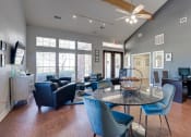 Thumbnail 36 of 41 - a living room with a round table and chairs and a desk with a computer at Paces Crossing, Denton, TX