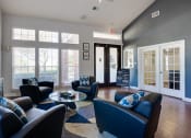 Thumbnail 37 of 41 - a living room with couches and chairs and a tv at Paces Crossing, Denton, 76210