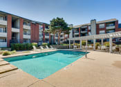 Thumbnail 19 of 41 - our apartments offer a swimming pool in front of our building at Paces Crossing, Denton, TX