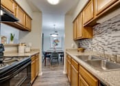 Thumbnail 12 of 72 - Steel sink in kitchen at Southern Oaks, Fort Worth, 76132  