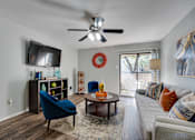 Thumbnail 9 of 72 - Couch in front of TV in a living room at Southern Oaks, Fort Worth, 76132  