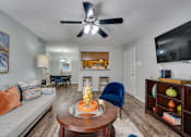 Thumbnail 6 of 72 - coffee table, and a ceiling fan in living room at Southern Oaks, Fort Worth, TX 76132  