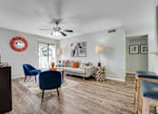 Thumbnail 8 of 72 - living room with white couch and blue chair at Southern Oaks, Texas