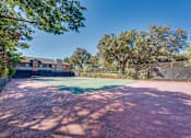 Thumbnail 34 of 72 - tennis court surrounded by trees at Southern Oaks, Fort Worth, TX 76132