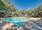 Thumbnail 31 of 72 - swimming pool surrounded by large trees at Southern Oaks, Texas, 76132