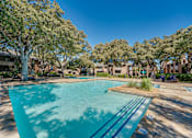 Thumbnail 22 of 72 - swimming pool surrounded by houses at Southern Oaks, Fort Worth, 76132