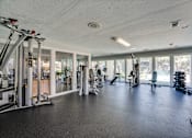 Thumbnail 36 of 72 - spacious gym with a variety of equipment at Southern Oaks, Fort Worth, TX