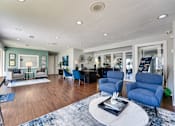 Thumbnail 49 of 72 - living room with blue chairs at Southern Oaks, Texas