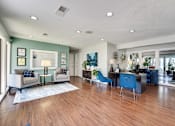 Thumbnail 60 of 72 - blue chair and a white couch in living room at Southern Oaks, Fort Worth, 76132  