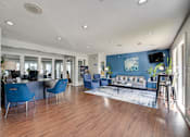 Thumbnail 54 of 72 - living with blue chairs and a wooden floor. at Southern Oaks, Texas, 76132