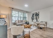 Thumbnail 6 of 53 - Open concept living and dining room with natural light at The Barton Apartments, Dallas, 75206